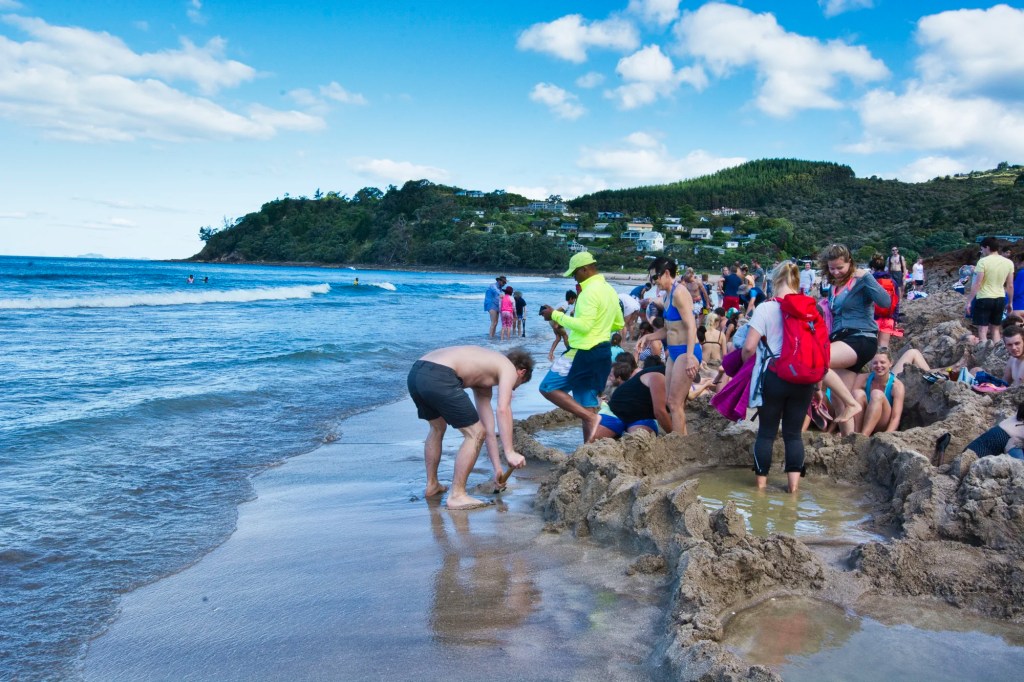 Digging Hot Pools , Hot Water Beach, NZ
