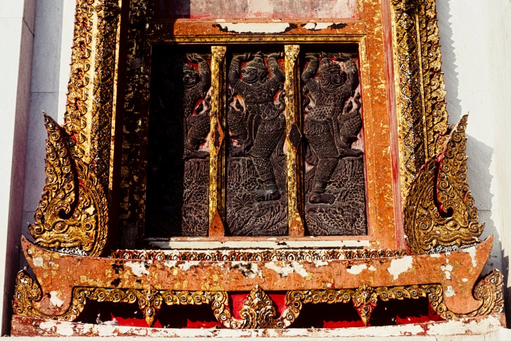 Black Bas-reliefs on Red Windows, Wat Benchamabophit, Bangkok, TH