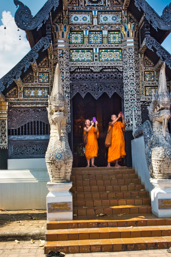 Monks taking photos with cell phone, Wat Chedi Luang, Chiang Mai